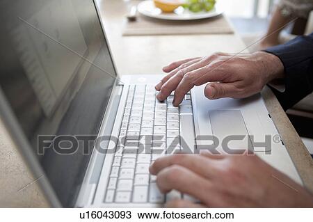 Close up of businessman using laptop View Large Photo Image Stock Image - Close up of businessman using laptop. Fotosearch