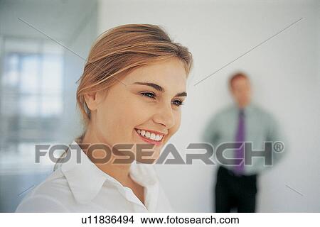Picture - Close up of businesswoman smiling. Fotosearch