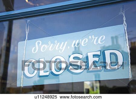 Stock Photography - Close up of ‘closed’ sign in shop window. Fotosearch