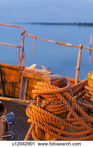 Close up of coiled rope on boat View Large Photo Image Stock Image - Close up of coiled rope on boat. Fotosearch