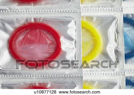 Stock Photo - Close up of colorful condoms. Fotosearch