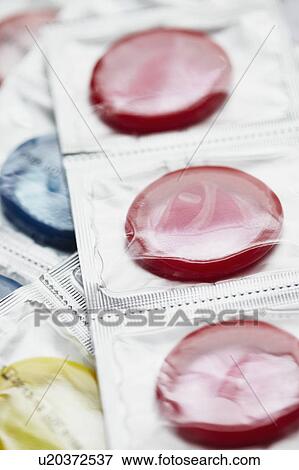 Close up of colorful condoms View Large Photo Image Stock Photo - Close up of colorful condoms. Fotosearch