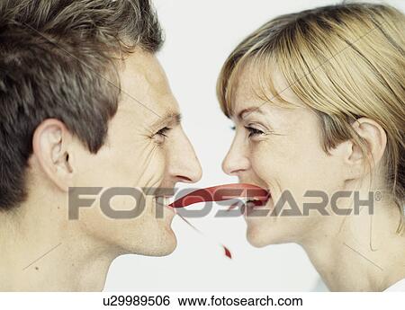 Close up of couple playing with ribbon View Large Photo Image Stock Photograph - Close up of couple playing with ribbon. Fotosearch