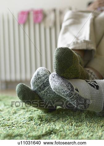 Close up of couple’s feet in socks View Large Photo Image Stock Image - Close up of couple’s feet in socks. Fotosearch