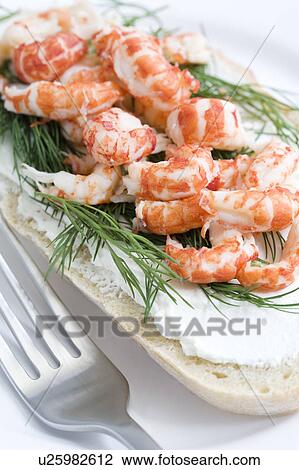 Stock Image - Close up of crayfish sandwich . Fotosearch