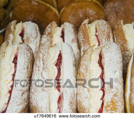 Close up of cream donuts View Large Photo Image Stock Photograph - Close up of cream donuts. Fotosearch