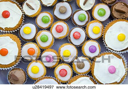 Stock Photo - Close up of decorated cupcakes. Fotosearch