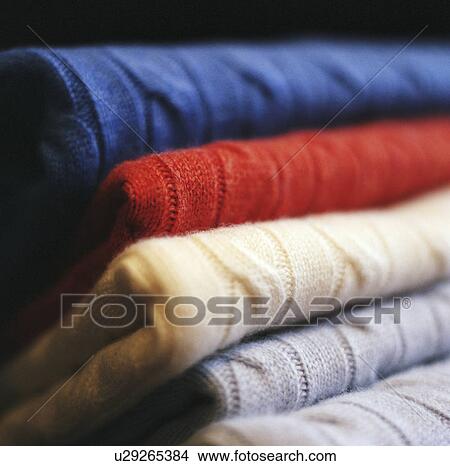 Close up of folded sweaters View Large Photo Image Picture - Close up of folded sweaters. Fotosearch