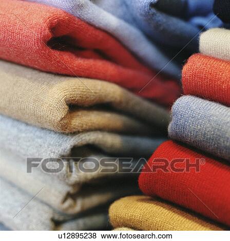 Close up of folded sweaters View Large Photo Image Stock Photo - Close up of folded sweaters. Fotosearch