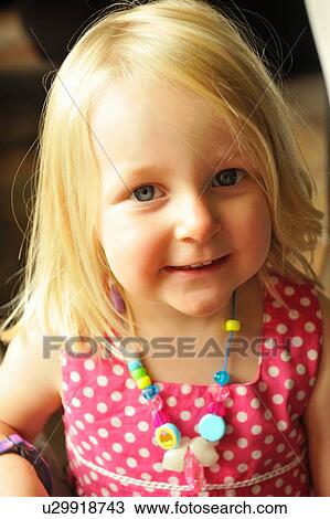 Stock Image - Close up of girl smiling. Fotosearch