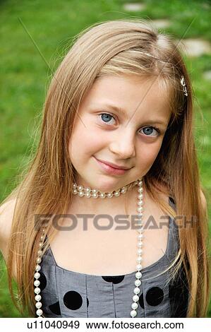 Stock Photo - Close up of girl smiling. Fotosearch