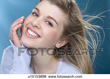 Stock Photo - Close up of girl smiling. Fotosearch