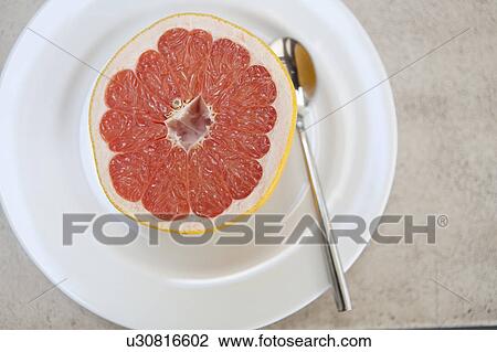 Close up of halved grapefruit View Large Photo Image Stock Image - Close up of halved grapefruit. Fotosearch