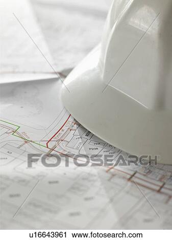 Close up of hard hat and blueprints View Large Photo Image Stock Image - Close up of hard hat and blueprints. Fotosearch