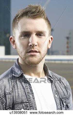 Close up of man on urban rooftop View Large Photo Image Stock Image - Close up of man on urban rooftop. Fotosearch