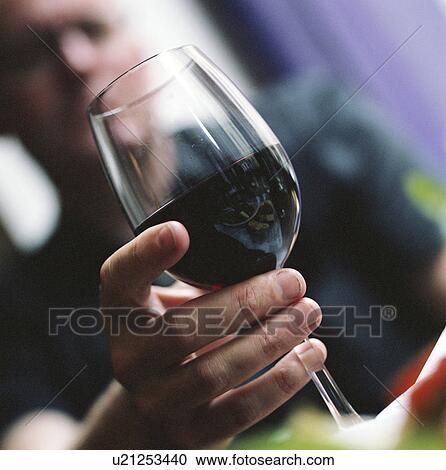 Close up of man with glass of red wine View Large Photo Image Stock Image - Close up of man with glass of red wine. Fotosearch