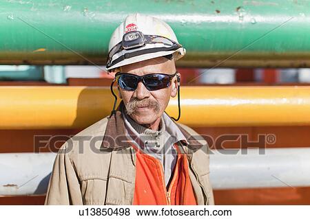 Stock Photo - Close up of oil rig worker. Fotosearch