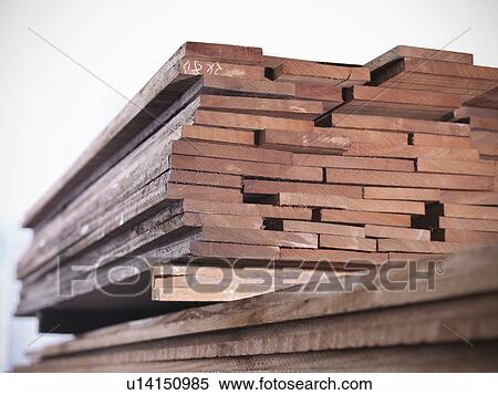 Stock Photography - Close up of planks of wood in joinery. Fotosearch