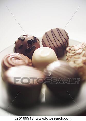 Close up of plate of chocolates View Large Photo Image Stock Photo - Close up of plate of chocolates. Fotosearch