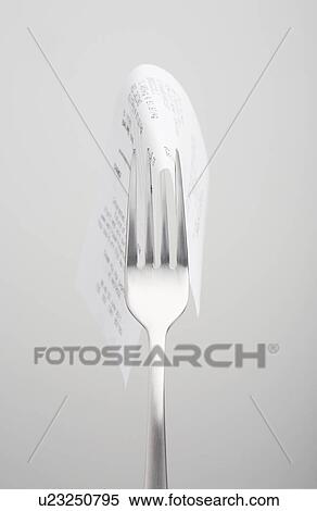 Stock Photography - Close up of receipt on fork. Fotosearch