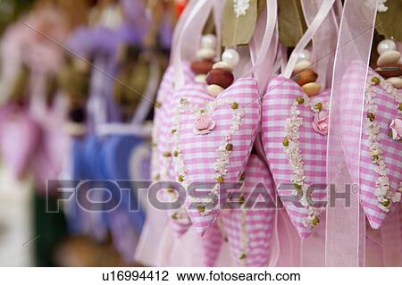 Stock Image - Close up of scented heart-shaped sachets. Fotosearch
