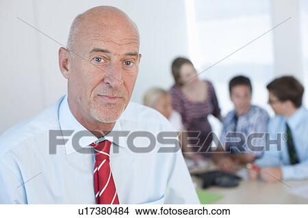 Picture - Close up of serious businessman’s face. Fotosearch