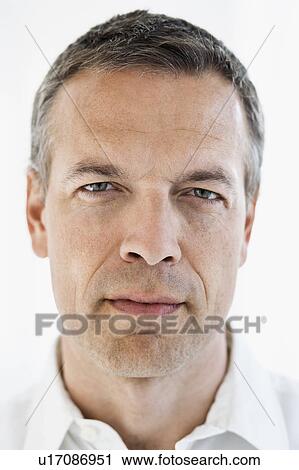 Close up of serious man’s face View Large Photo Image Stock Image - Close up of serious man’s face. Fotosearch
