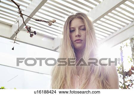 Picture - Close up of serious woman’s face. Fotosearch