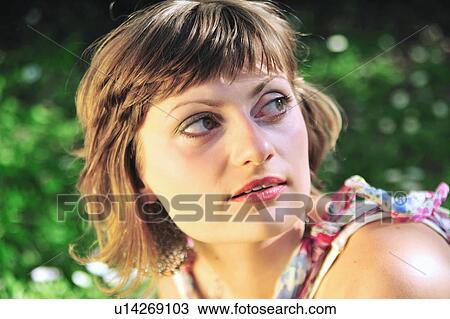 Stock Image - Close up of serious woman's face. Fotosearch