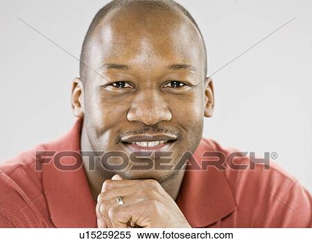 Stock Photography - Close up of smiling man’s face. Fotosearch
