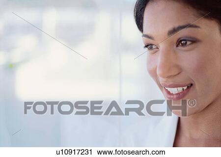 Stock Image - Close up of smiling woman. Fotosearch