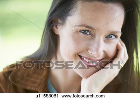 Stock Image - Close up of smiling woman. Fotosearch