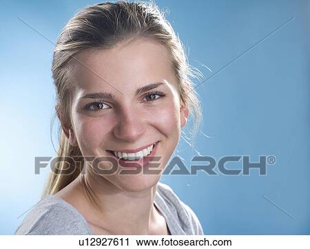 Stock Image - Close up of smiling woman. Fotosearch