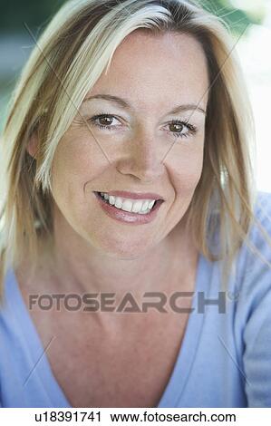 Stock Image - Close up of smiling woman. Fotosearch