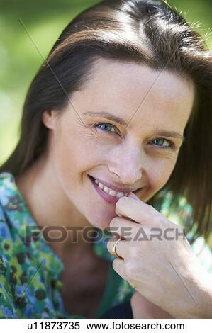 Close up of smiling woman View Large Photo Image Stock Photography - Close up of smiling woman. Fotosearch