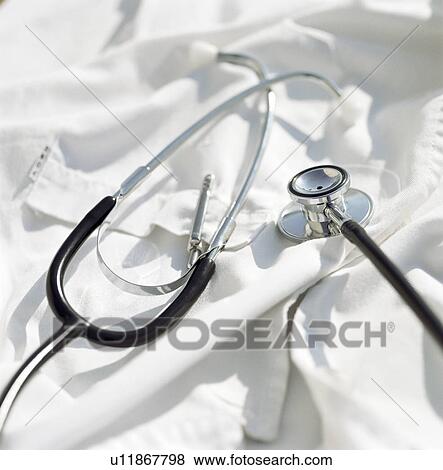 Close up of stethoscope on lab coat View Large Photo Image Stock Photo - Close up of stethoscope on lab coat. Fotosearch