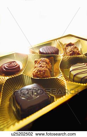 Stock Image - Close up of tray of chocolates. Fotosearch