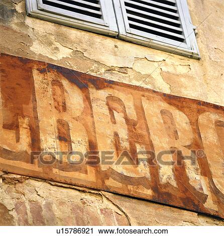Close up of weathered sign on building View Large Photo Image Stock Image - Close up of weathered sign on building. Fotosearch