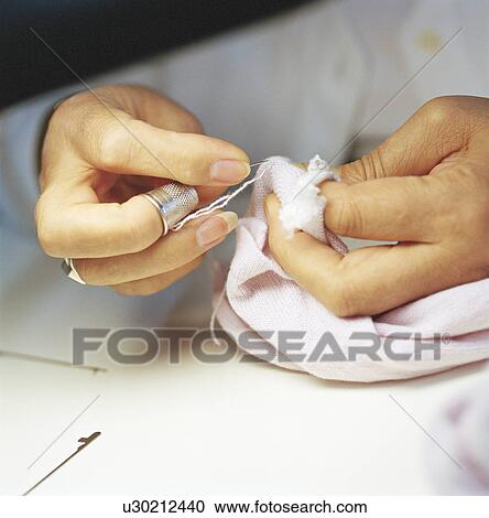 Close up of woman sewing View Large Photo Image Stock Image - Close up of woman sewing. Fotosearch