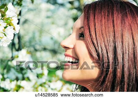 Close up of woman smiling outdoors View Large Photo Image Stock Photography - Close up of woman smiling outdoors . Fotosearch