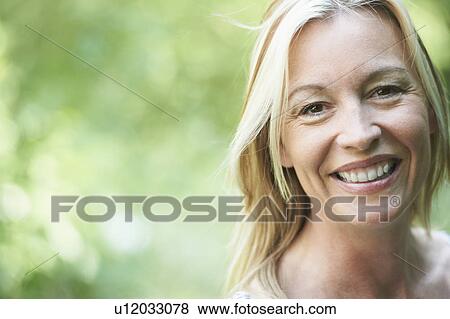 Close up of woman smiling View Large Photo Image Stock Photo - Close up of woman smiling. Fotosearch