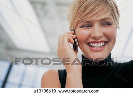 Close up of woman talking on cell phone View Large Photo Image Stock Photo - Close up of woman talking on cell phone. Fotosearch