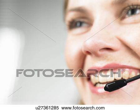 Close up of woman wearing headset View Large Photo Image Stock Photography - Close up of woman wearing headset. Fotosearch