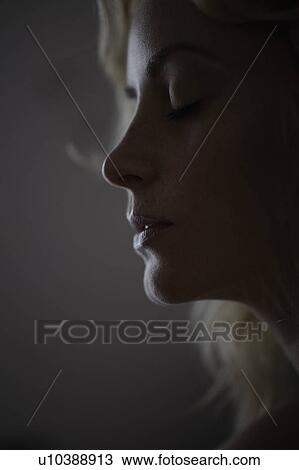 Stock Image - Close up of woman’s face. Fotosearch