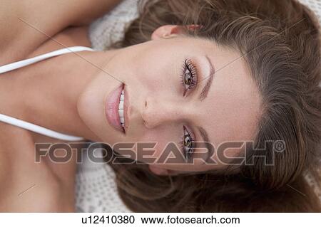 Stock Image - Close up of woman’s face. Fotosearch