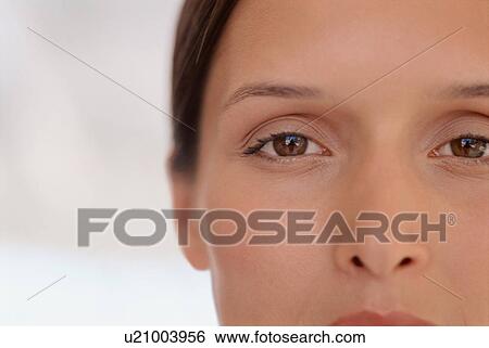 Stock Photograph - Close up of woman’s face. Fotosearch