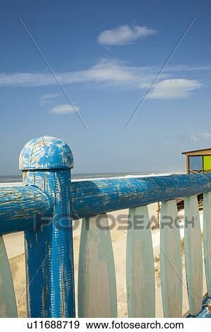 Stock Photo - Close up of wooden railing on beach. Fotosearch
