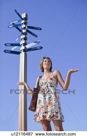 Stock Photo - Confused woman at crossroads. Fotosearch