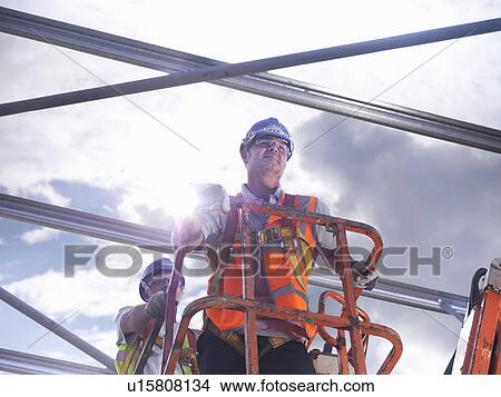 Construction workers in cherry picker View Large Photo Image Picture - Construction workers in cherry picker. Fotosearch