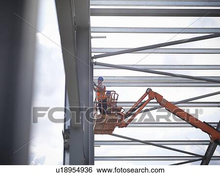 Construction workers in cherry picker View Large Photo Image Stock Photograph - Construction workers in cherry picker. Fotosearch